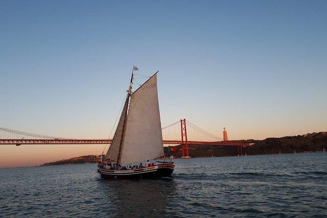 2-Hour Lisbon Traditional Boats Sunset Cruise with White Wine - From Commerce Square to the 25 de Abril Bridge