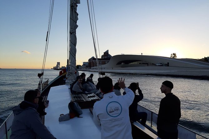 2-Hour Lisbon Traditional Boats Sunset Cruise with White Wine - Alfama, the cathedral, and the castle from below