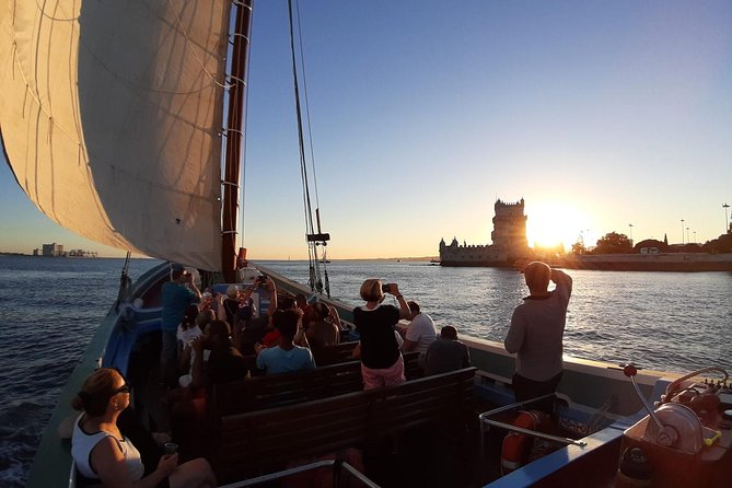 2-Hour Lisbon Traditional Boats Sunset Cruise with White Wine - Wine, music, and the mood on board
