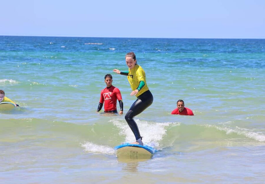 Albufeira: Beginner Surf Lesson - Small groups, personal attention, and crowded summer sand
