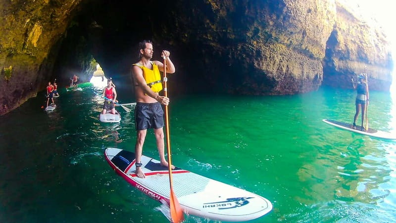 Albufeira: Caves and cliffs Paddleboarding (SUP) Tour - Passing through the caves