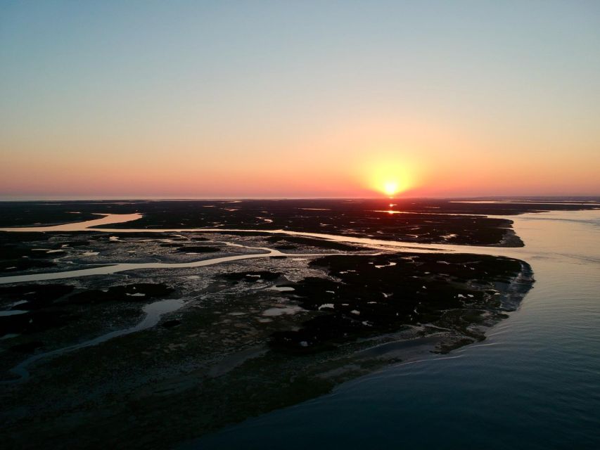 Faro: Ria Formosa Sunset Nature Boat Tour - What you see between Faro and the barrier islands