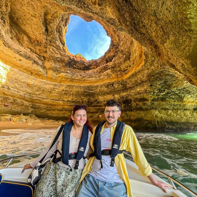 From Faro: Boat trip to Benagil Cave & Praia da Marinha - Boarding the small boat at Benagil