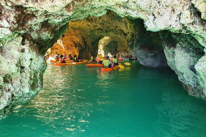From Lagos: Kayak Tour of Ponta da Piedade Caves on Catamaran - Returning to the boat for a swim