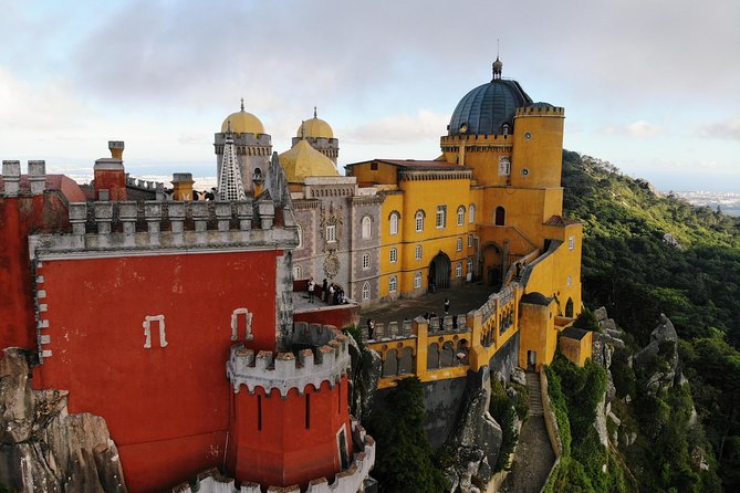 From Lisbon: Sintra's Historical and Natural Gems - Pena Palace terraces, color, and mountain views