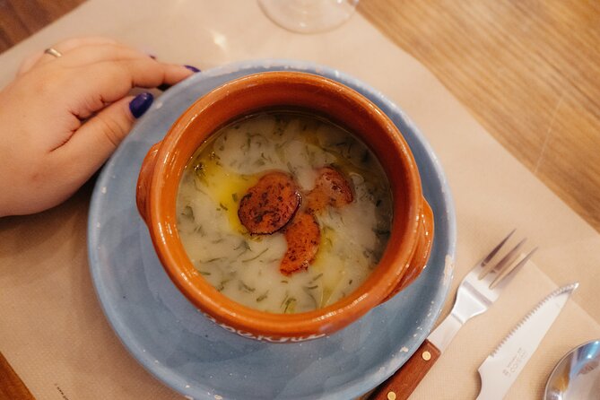 Heart of Lisbon Food Tour: Baixa, Chiado & Bairro Alto - Bifana beneath a former church in Chiado