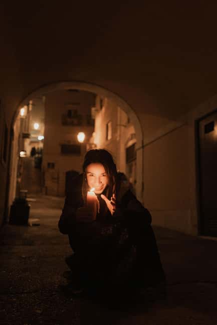 Lisbon by Night: Guided Walking Tour - The Unholy Secrets - Narrow streets, old prisons, and the climb toward Alfama