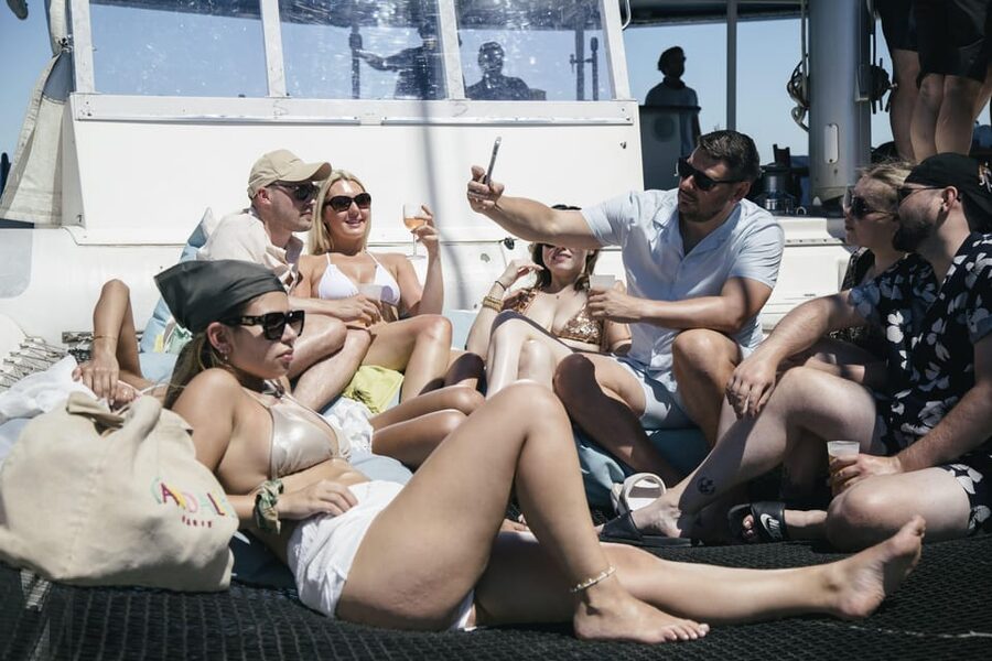 Lisbon: Catamaran Boat Party with Music, Open Bar & Dives - Booking, weather, and practical planning