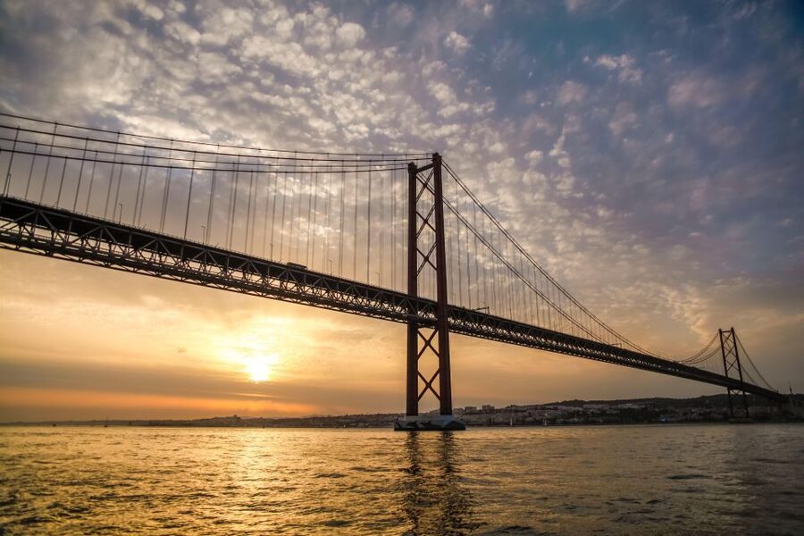 Lisbon: Disco Night Cruise with DJ and Open Bar - Christ the King across the water