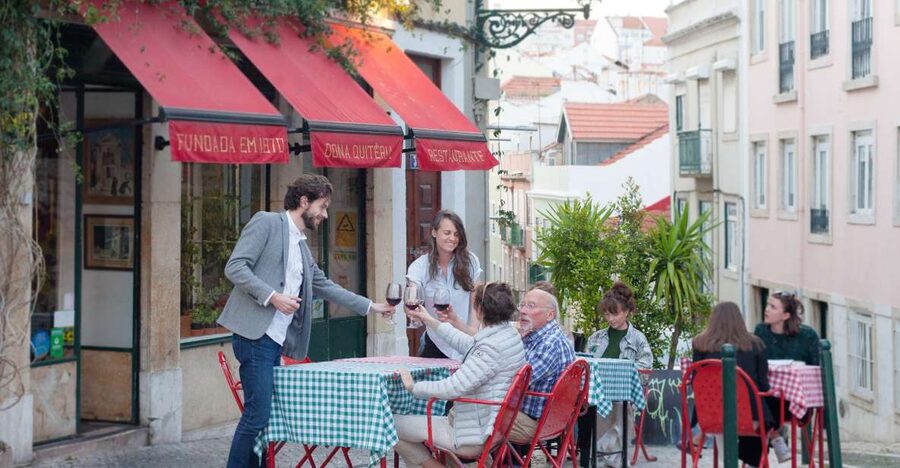 Lisbon: Evening Local Food Crawl with Drink Pairings - The Parliament meeting point and the first climb