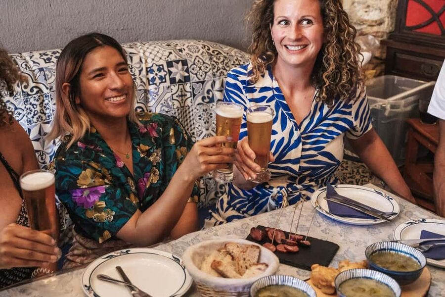 Lisbon: Food Crawl Walking Tour with Local Tastings - Baixa through food, squares, and local stories