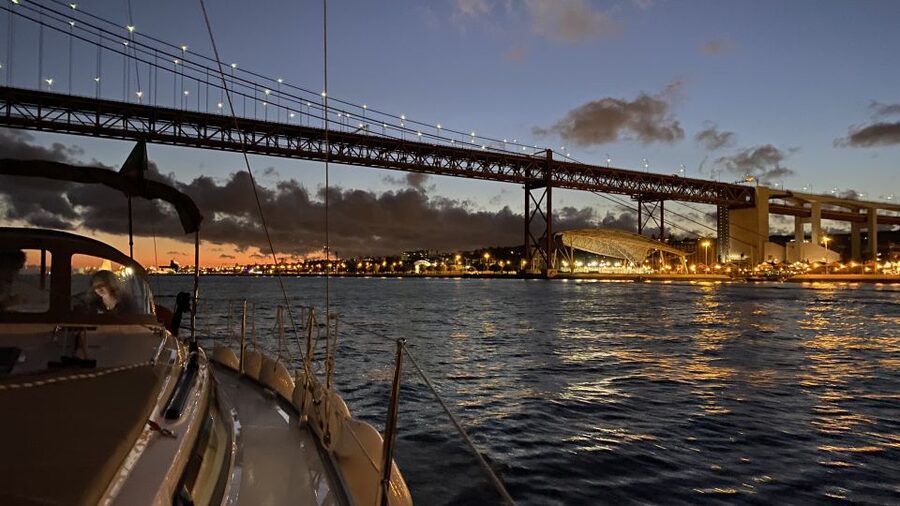 Lisbon: Luxury Sailboat Cruise at Night - Passing under the 25 de Abril Bridge