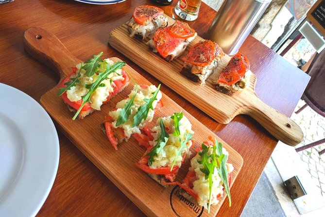 Lisbon Small-Group Food Tour with 18 Tastings in Alfama District - Starting at Portas do Sol