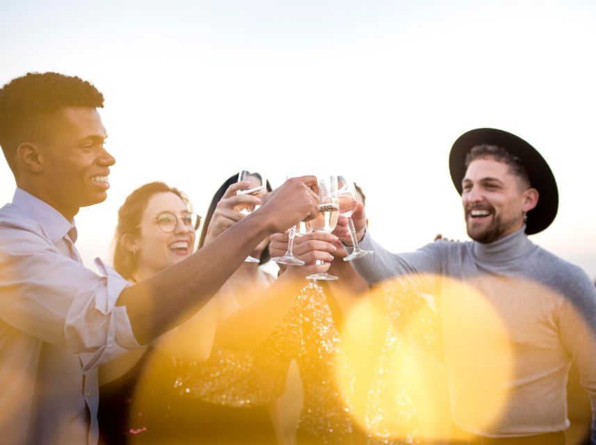 Lisbon: Sunset Boat Party Cruise with DJ and Open Bar - Commerce Square from the water