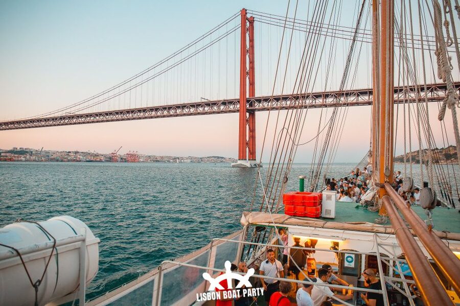 Lisbon: Sunset Boat Party with 2 Drinks and Free Club Entry - A sunset party with Lisbon as the backdrop