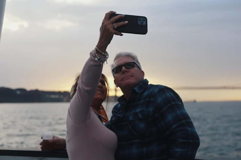 Lisbon: Sunset Boat Tour with Music and Drinks - Cold evenings, blankets, and weather limits