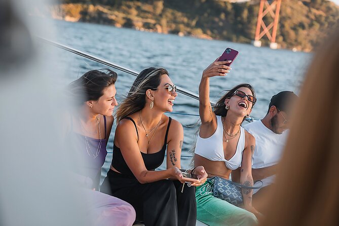 Lisbon: Sunset Catamaran Boat Tour with Music and Drinks - Discoveries, Jerónimos, and the western riverfront