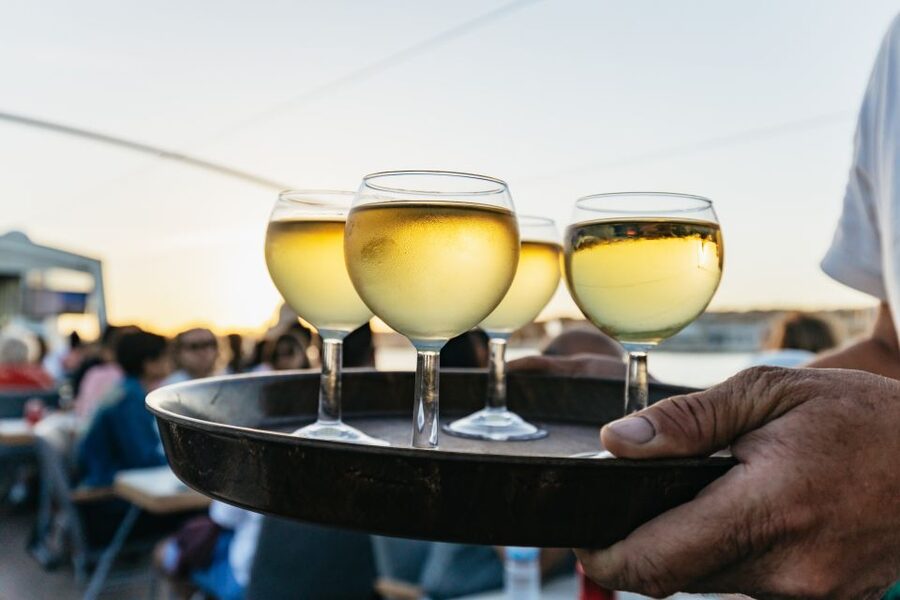 Lisbon: Sunset Cruise with Welcome Drink and Snacks - Seating, music, and the onboard mood