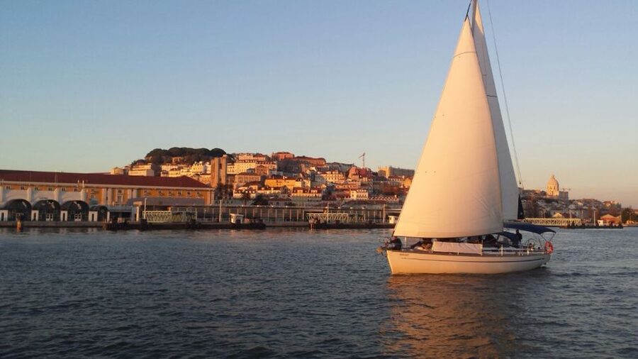 Lisbon: Sunset Sailing Boat Tour with Drinks - The sunset and Lisbon after dark