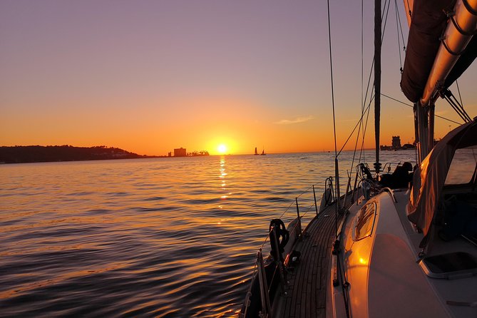Lisbon Sunset Sailing Tour on Luxury Sailing Yacht with 2 Drinks - Wine, cheese, and the sunset pause