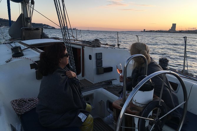 Lisbon Sunset Sailing Tour with White or Rosé Wine and Snacks - Reaching Belém Tower by water