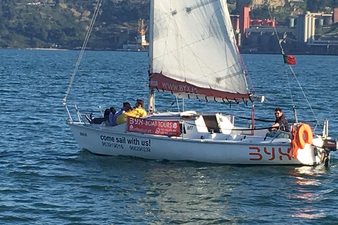 Lisbon Sunset Sailing Tour with White or Rosé Wine and Snacks - Passing the Padrão dos Descobrimentos