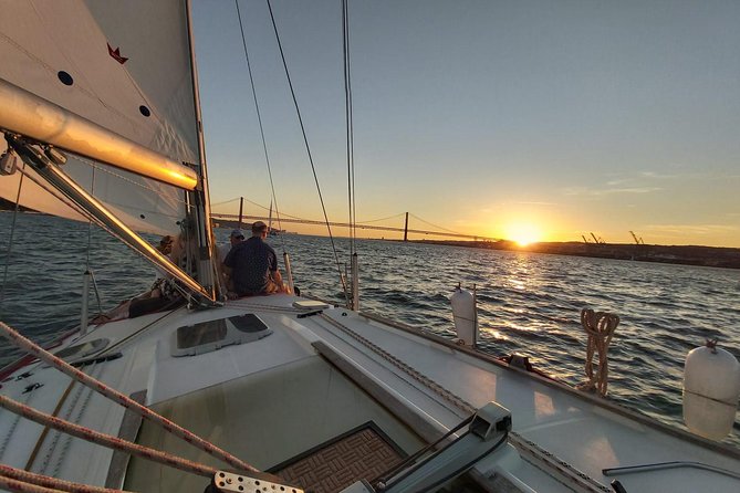 Lisbon: Sunset Sailing with Portuguese Wine and History - The 25 de Abril Bridge at sunset
