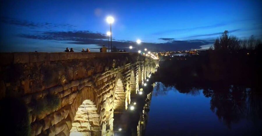 Merida: Legends and Mysteries Night Tour - Passing the Arab Alcazaba toward the Guadiana