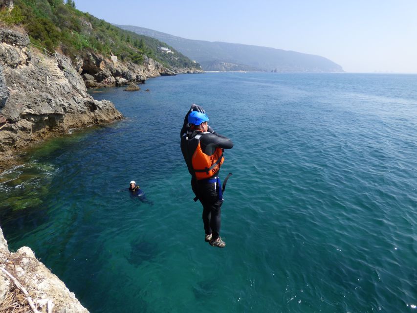 Portinho da Arrábida: Coasteering Boat Tour - Rappelling down the rock face