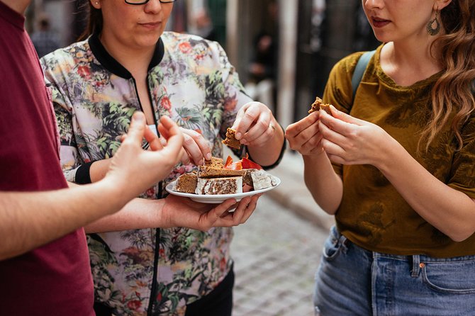 Porto Private Food and Drink Tasting Tour with Local - Pork sandwiches, cod cakes, and Portuguese comfort food