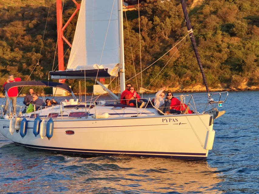 Private Lisbon Sightseeing Sailing Boat Tour with Locals - Passing Alcântara and the bridge near Cristo Rei