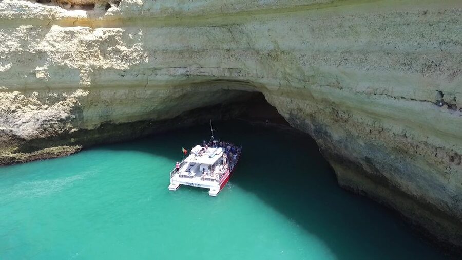 Quarteira: Benagil Cave Guided Catamaran Day Cruise & Drink - Vilamoura Marina is the starting point